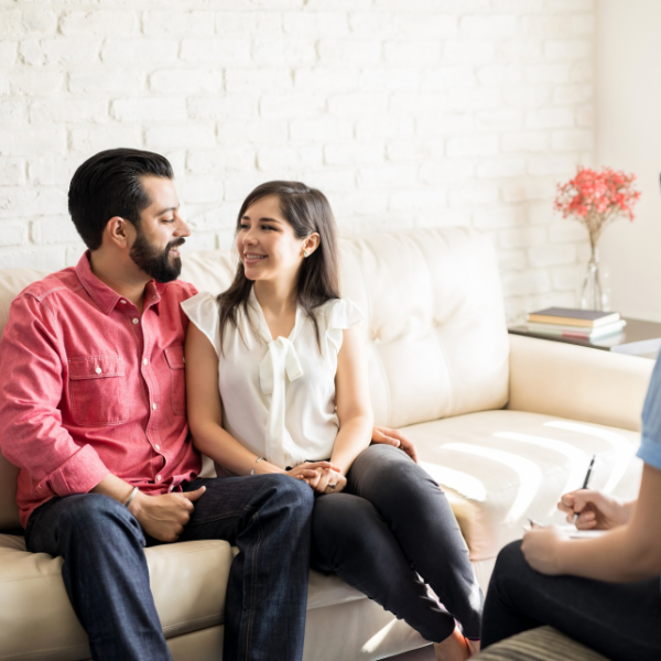 man and woman talking to